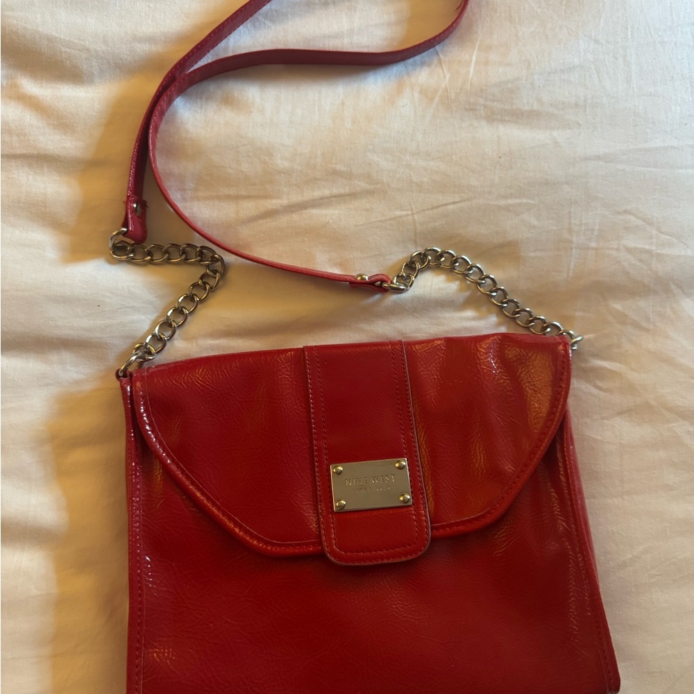 Red Patent Nine West Crossbody bag with gold chain link embellishment